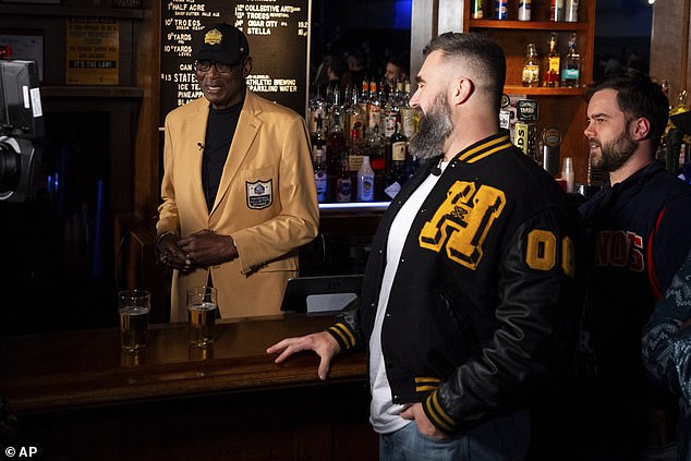 Former NFL player and ESPN analyst Jason Kelce, right, performs a skit with NFL Hall of Famer Harold Carmichael, left