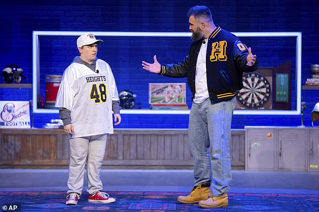 Former NFL player and ESPN analyst Jason Kelce, right, performs a skit with a younger version of himself during the taping
