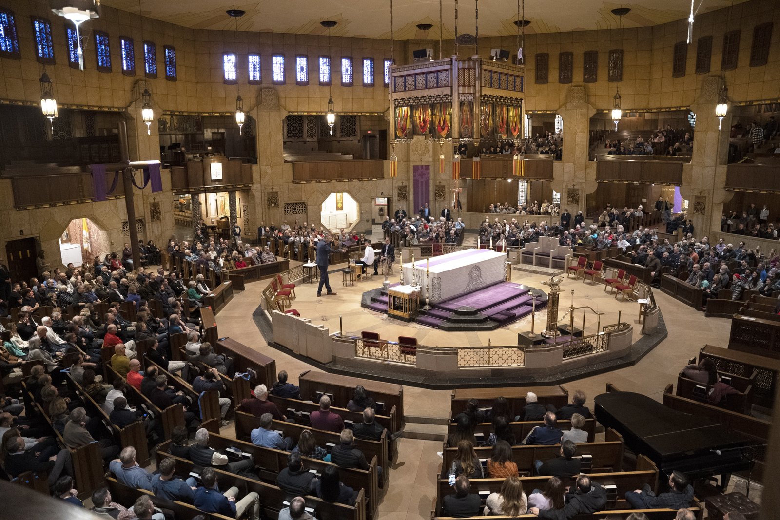 A capacity congregation listens to Harbaugh, McCormick and Fr. Riccardo talk about life, family and the centrality of faith.