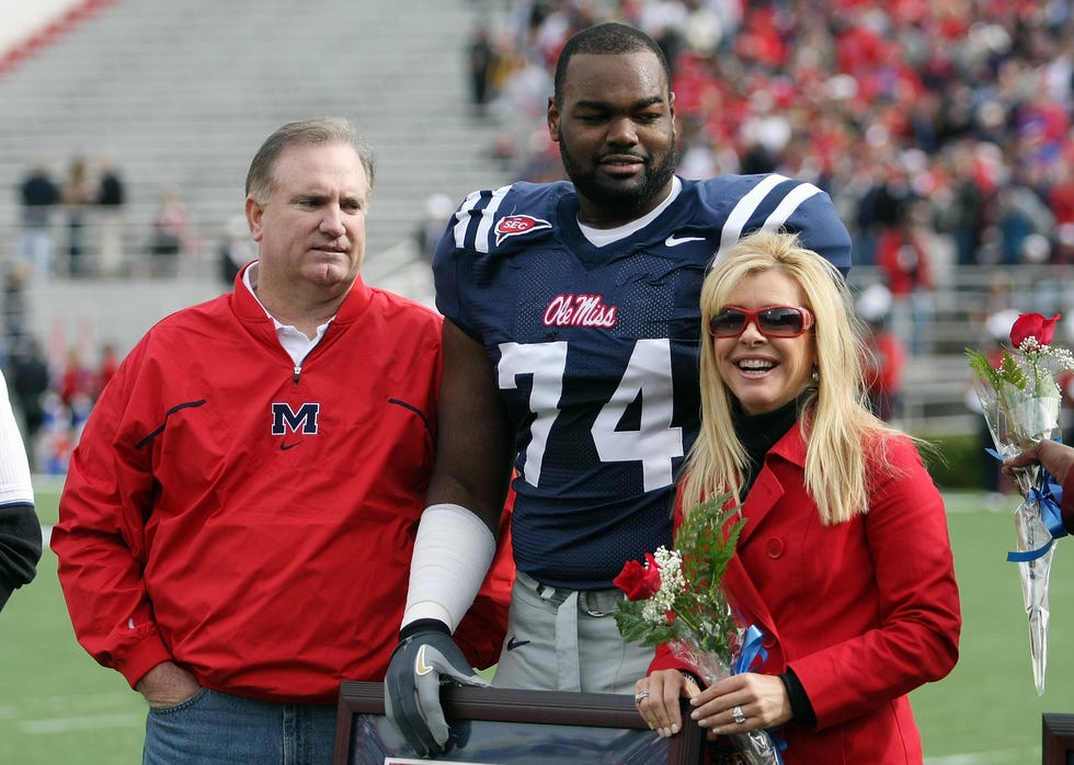 michael oher stands with his family during senior ceremonies prior to a game against the mississippi state bulldogs at vaught hemingway stadium on november 28, 2008, in oxford, mississippi