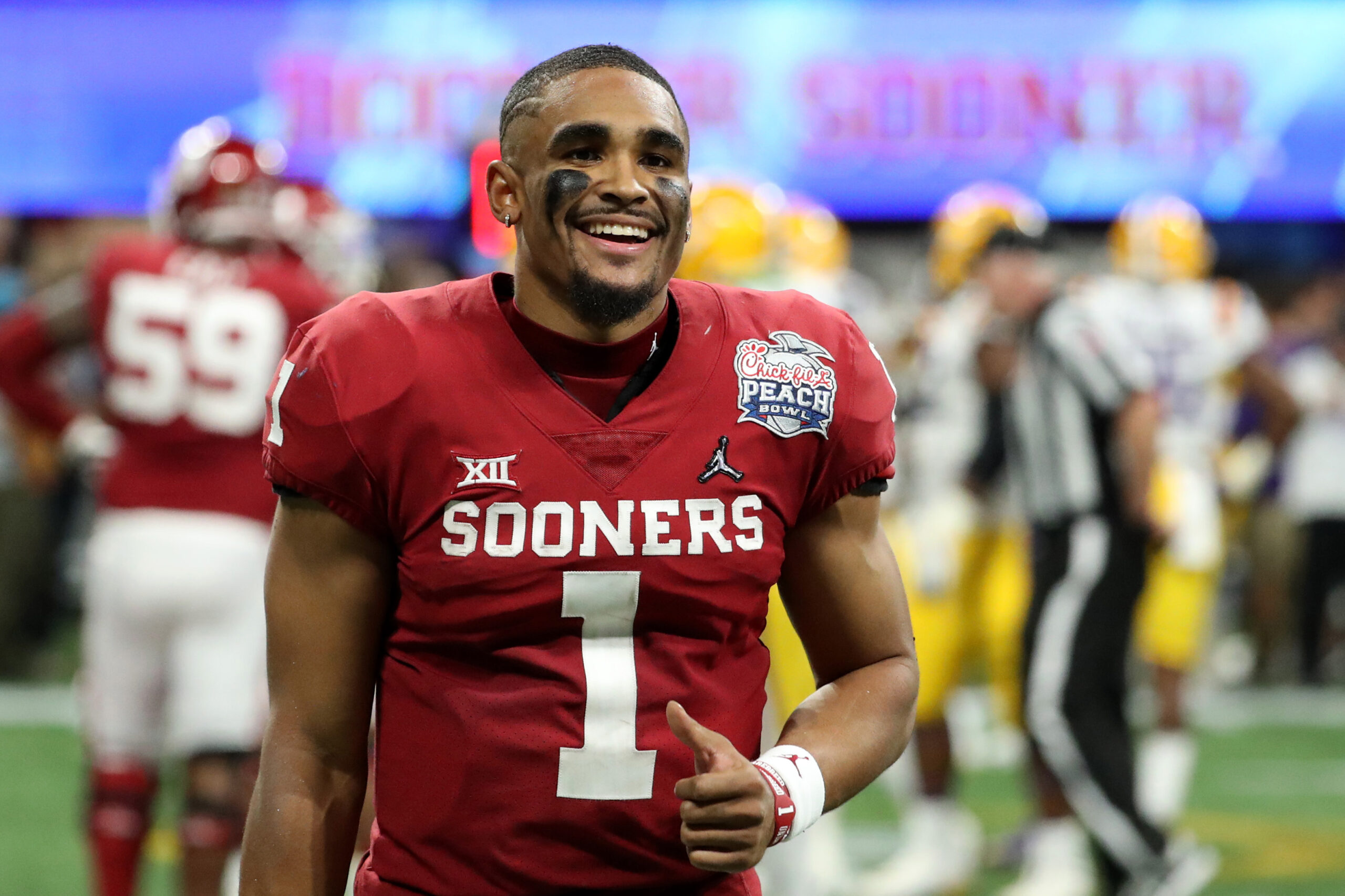 Dec 28, 2019; Atlanta, Georgia, USA; Oklahoma Sooners quarterback Jalen Hurts (1) reacts during the fourth quarter of the 2019 Peach Bowl college football playoff semifinal game between the LSU Tigers and the Oklahoma Sooners at Mercedes-Benz Stadium.