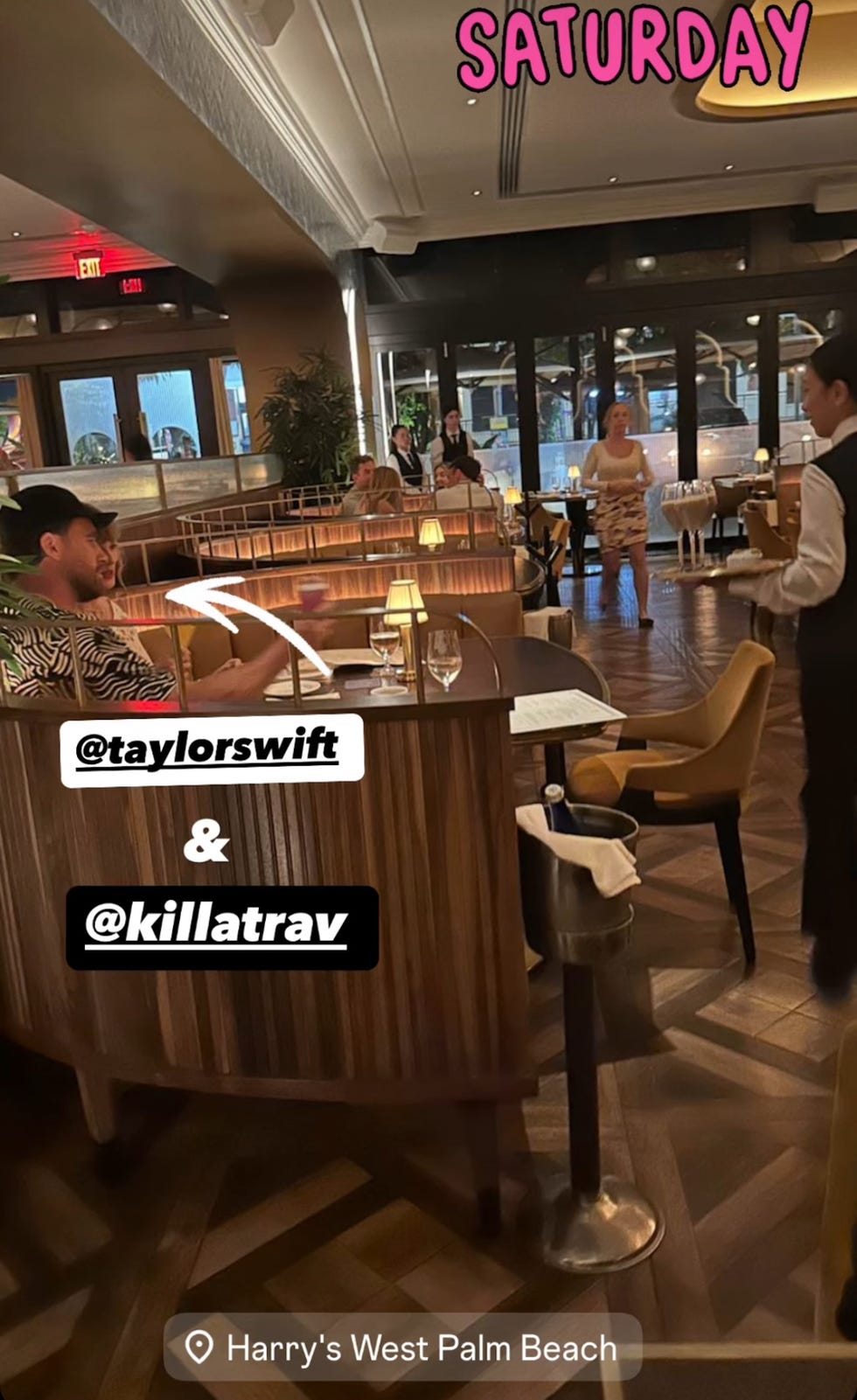 diners at a restaurant with warm lighting and a lively atmosphere