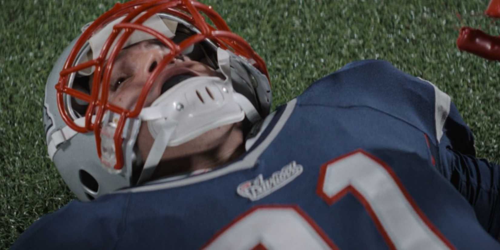 Josh Rivera on the ground as Aaron Hernandez in American Sports Story