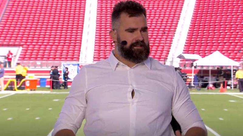 Jason Kelce wearing a white dress shirt on a NFL tv broadcast