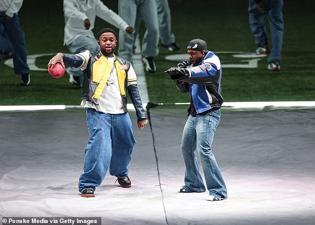 DJ Mustard (L), a frequent collaborator of Lamar's, performs with the rapper at the show