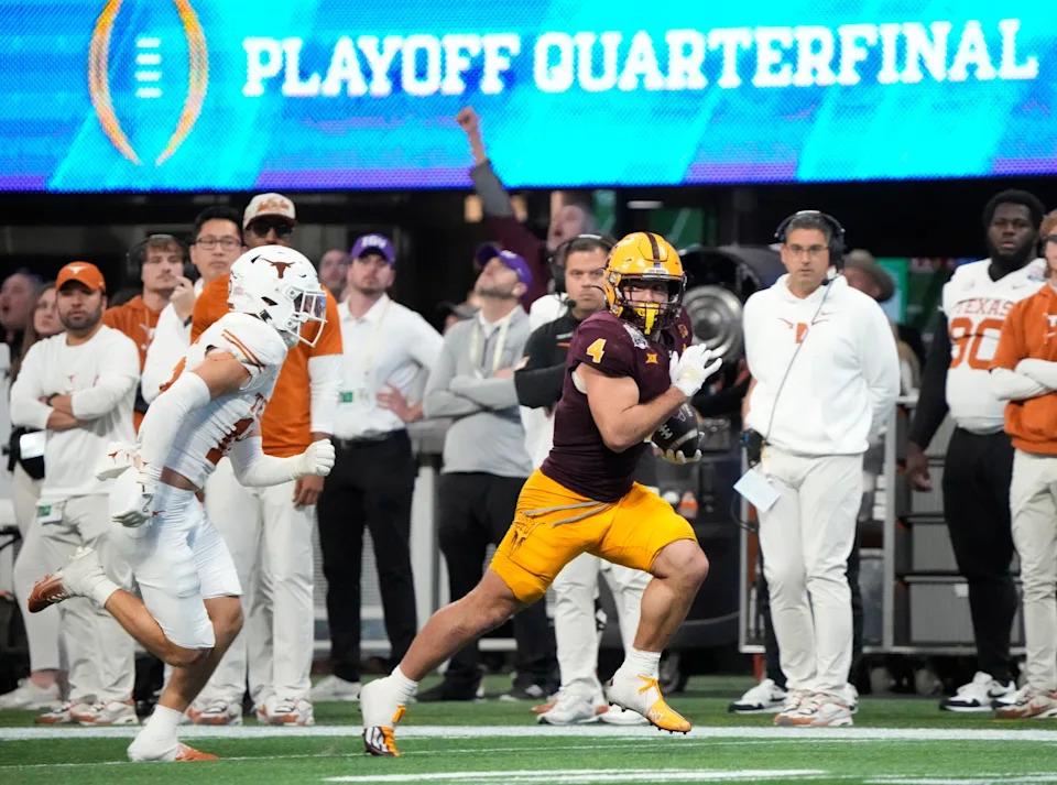 Arizona State running back Cam Skattebo (4) runs after a catch against Texas defensive back Andrew Mukuba (4) during the fourth quarter in the Chick-fil-A Peach in Atlanta on Wednesday, Jan. 1, 2025.