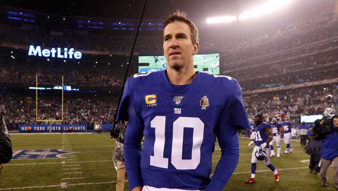 Eli Manning #10 of the New York Giants walks on the field at MetLife Stadium Eli Manning #10 of the New York Giants walks on the field at MetLife Stadium