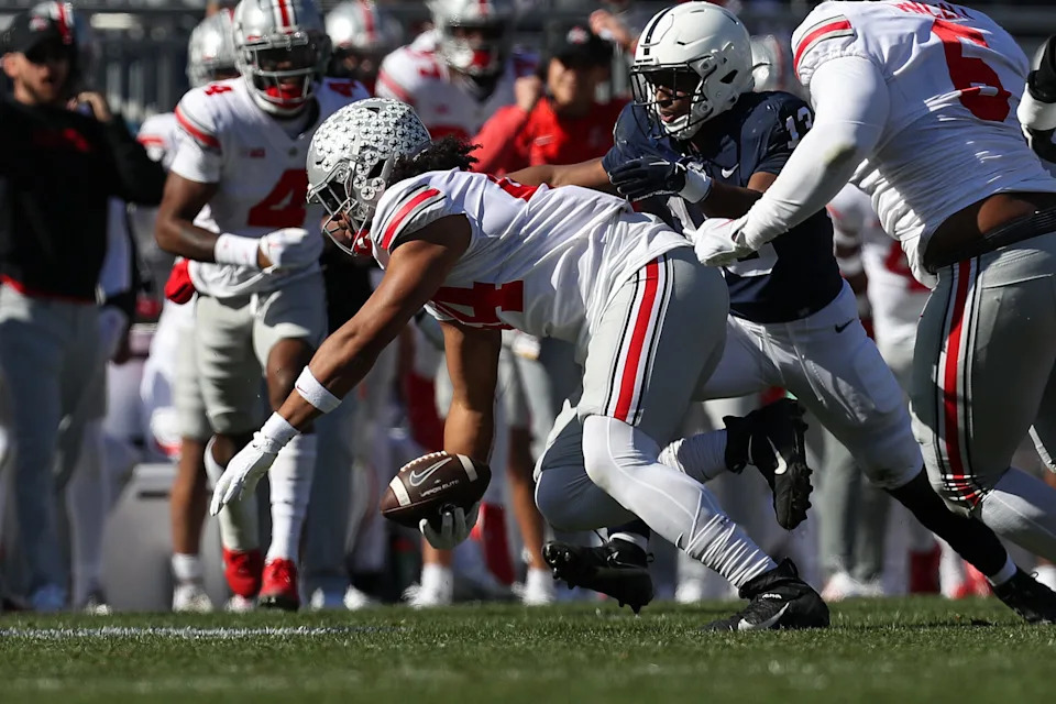 Oct 29, 2022; University Park, Pennsylvania, USA; Ohio State Buckeyes defensive end J.T. Tuimoloau (44) intercepts the ball during the first quarter against the Penn State Nittany Lions at Beaver Stadium. Mandatory Credit: Matthew OHaren-USA TODAY Sports