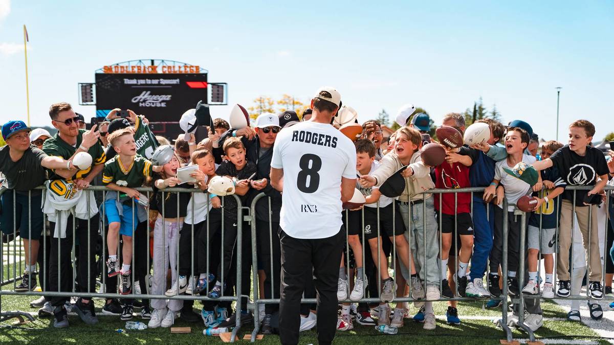 Aaron Rodgers signs autographs at the RX3 Charity Flag Football