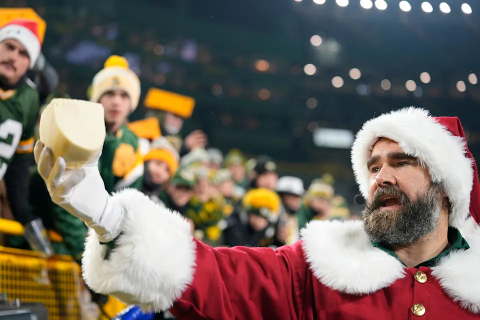 ESPN broadcaster and former professional football player Jason Kelce interacts with fans before the game between the New Orleans Saints and the Green Bay Packers at Lambeau Field on Dec. 23, 2024, in Green Bay, Wis.