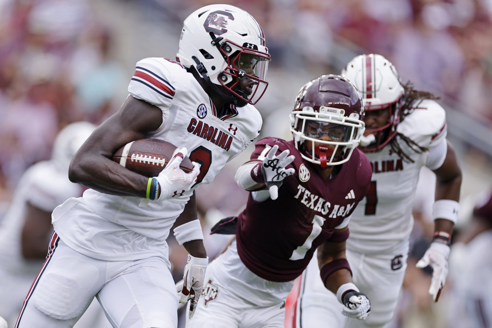 Nyck Harbor Wide Receiver Carolina brushes off a defender, showcasing why he's the deep sleeper for 2026 Dynasty Rookie Big Board.