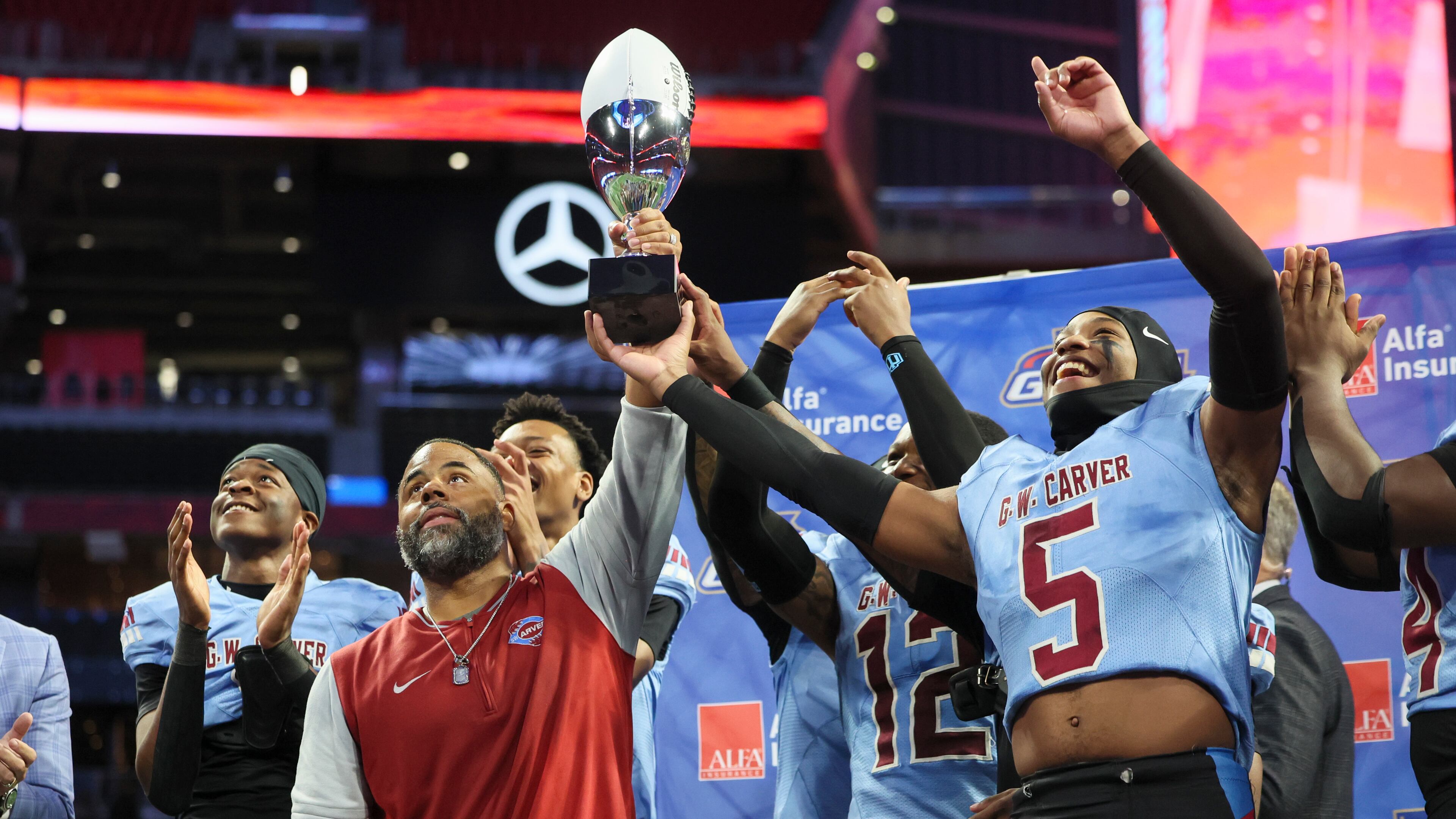 Carver-Columbus won the state title last season with coach Pierre Coffey (left center), but the team will start its quest to repeat with a new coach, Jarvis Jones. Coffey left the school to become the principal at Stewart County High School. (Jason Getz/AJC 2024)