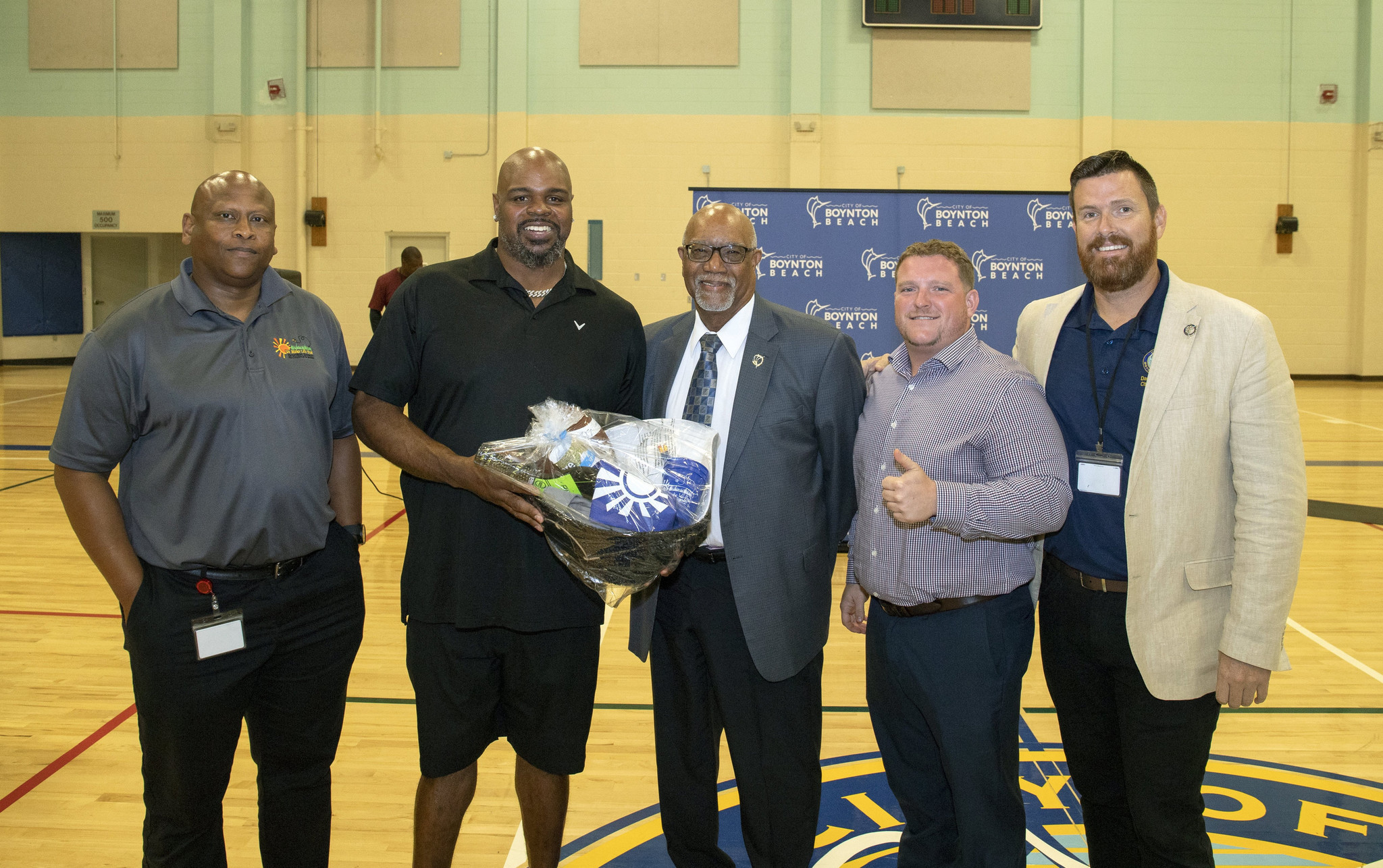Retired NFL player Vince Wilfork, second from left, meets with city of Boynton Beach officials during his visit to the Ezell Hester Center.