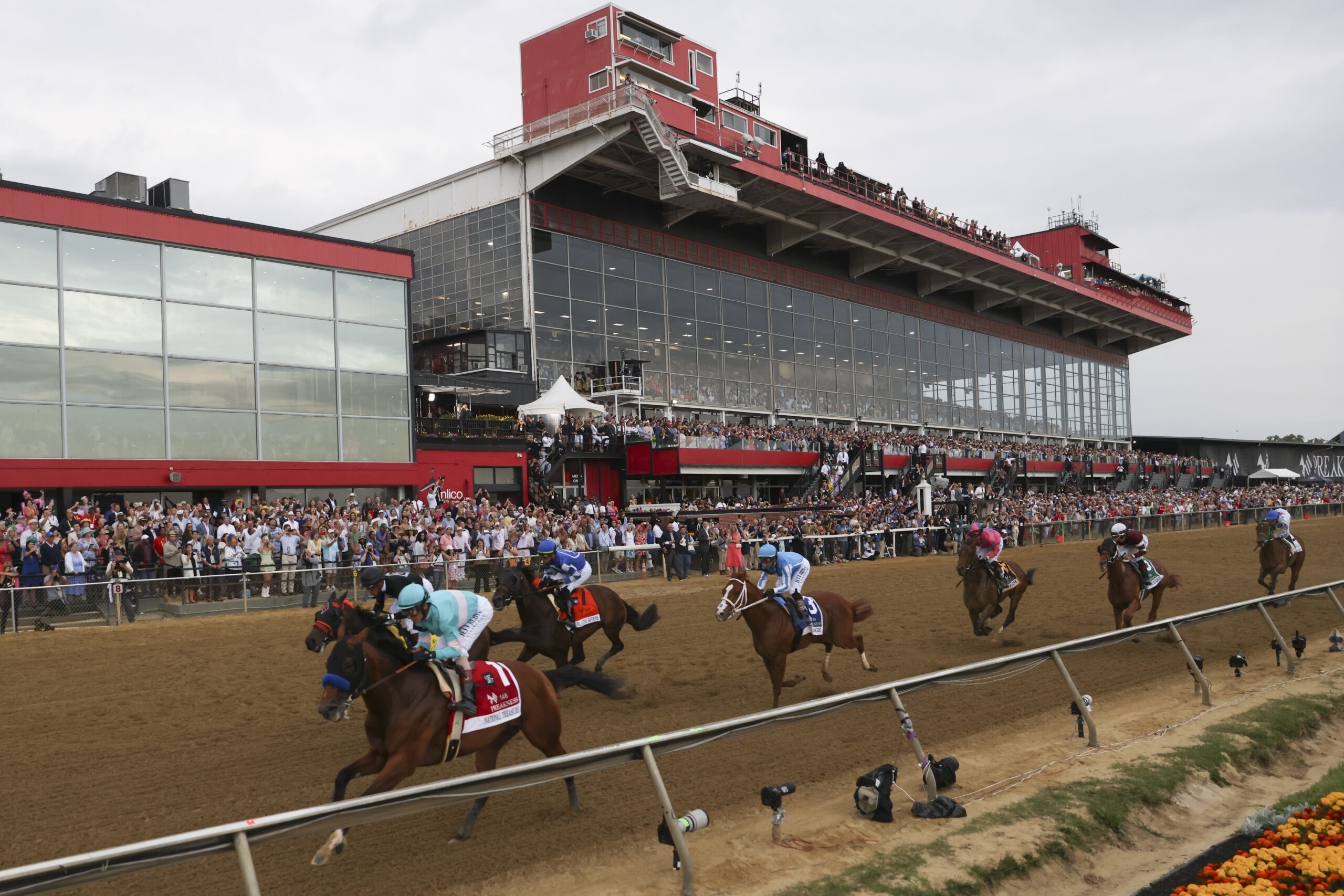 National Treasure, bottom left, leads the pack toward the first turn during the 148th running of the Preakness Stakes horse race at Pimlico Race Course on May 20, 2023, in Baltimore. Maryland Gov. Wes Moore signed a measure to rebuild Baltimore’s historic but antiquated Pimlico Race Course and transfer the track to state control. (AP Photo/Julia Nikhinson, File)