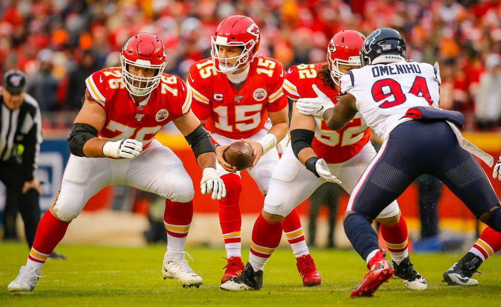 kansas city, mo january 12 laurent duvernay tardif 76 of the kansas city chiefs prepares to block for patrick mahomes 15 of the kansas city chiefs during the second quarter of the afc divisional playoff game against the houston texans at arrowhead stadium on january 12, 2020 in kansas city, missouri photo by david eulittgetty images