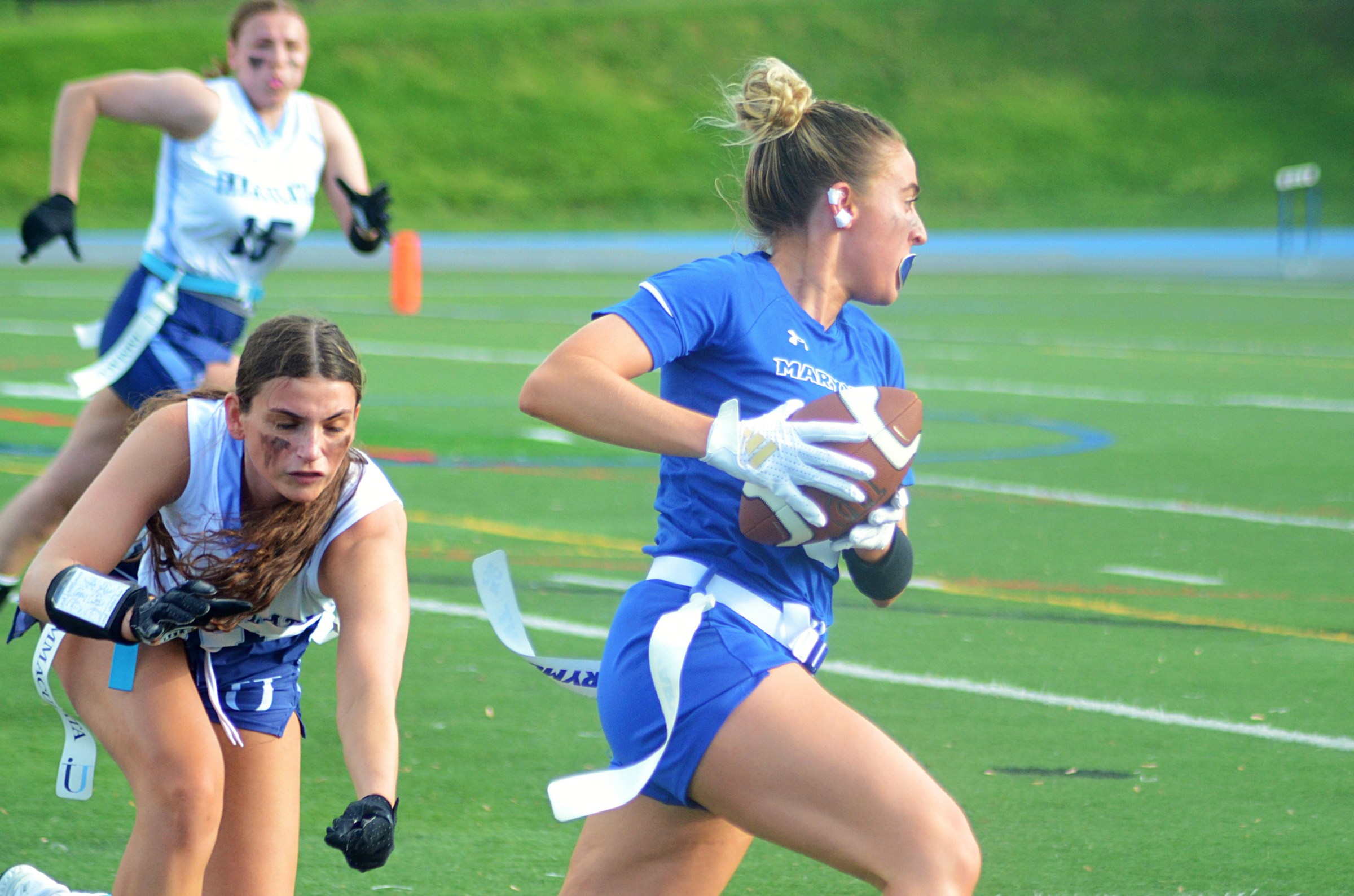 Marymount’s Samantha Bulik outruns and avoids a would-be flag-puller in the semifinals of the Atlantic East Championship for women’s flag football on Saturday, April 26, 2025, in Arlington, Va.