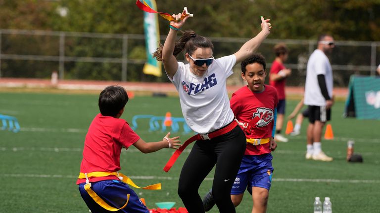 Gabriela Bankhardt participates in drills with kids during the Chiefs NFL Flag clinic in Sao Paulo