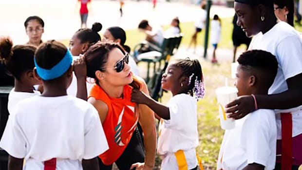 Florida Senior team star quarterback Rakyia Louis, as a child, participating in Dr. Jen Walter's Grrridiron camp.