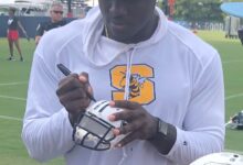 Archival full-frame photograph of A.J. Brown signing autographs at 2019 Titans training camp