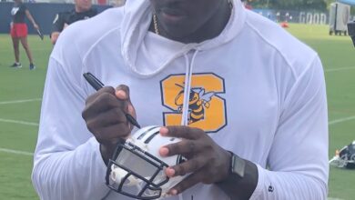 Archival full-frame photograph of A.J. Brown signing autographs at 2019 Titans training camp