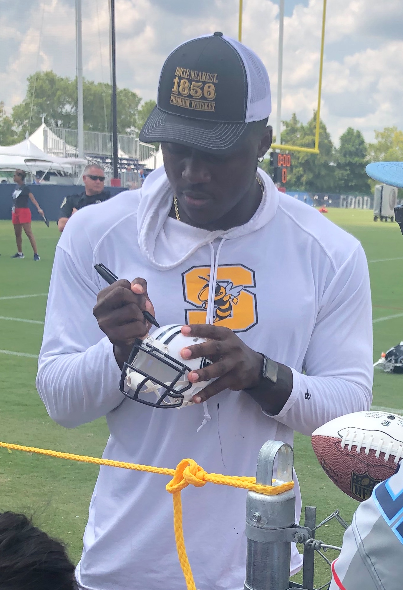 Archival full-frame photograph of A.J. Brown signing autographs at 2019 Titans training camp