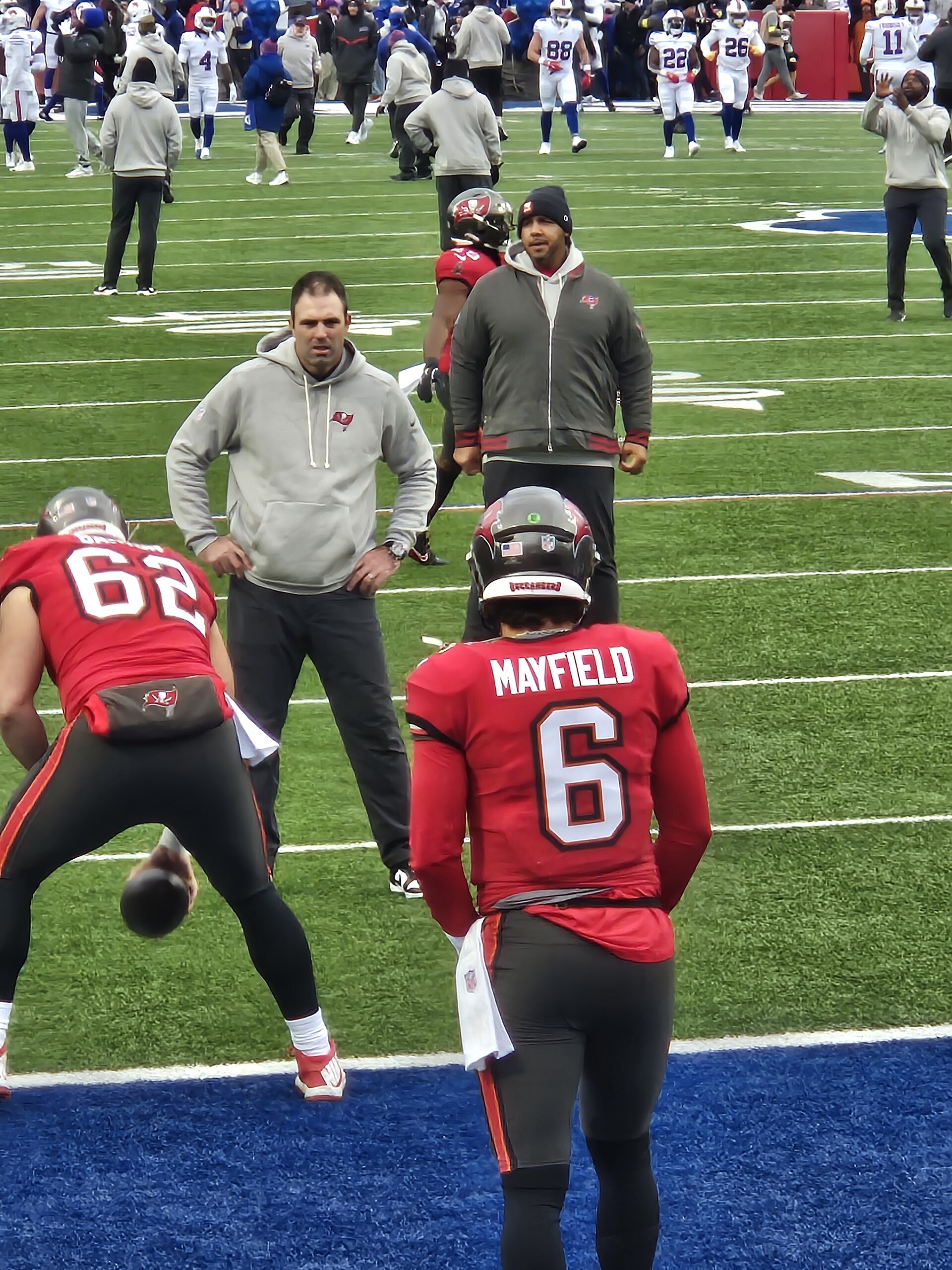 Archival full-frame photograph of Baker Mayfield and Graham Barton warming up before a 2025 Buccaneers game