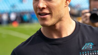 Archival full-frame photograph of Christian McCaffrey warming up before a Carolina Panthers game in 2019