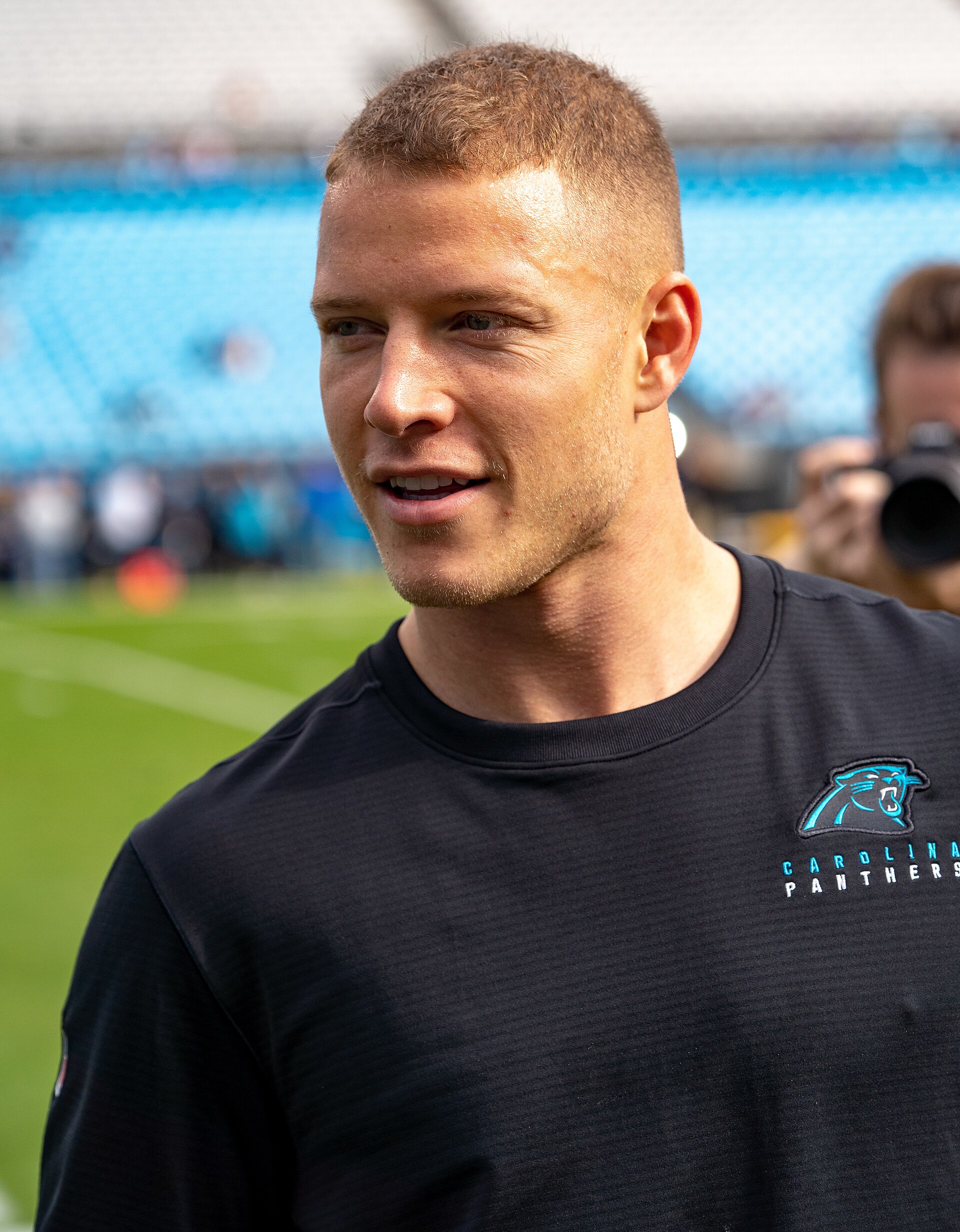 Archival full-frame photograph of Christian McCaffrey warming up before a Carolina Panthers game in 2019