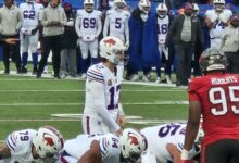 Archival photograph of Buffalo Bills quarterback Josh Allen preparing to take a snap during a 2025 game