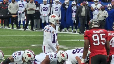Archival photograph of Buffalo Bills quarterback Josh Allen preparing to take a snap during a 2025 game