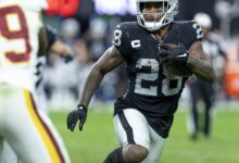 Archival full-frame photograph of Josh Jacobs playing for the Las Vegas Raiders in December 2021