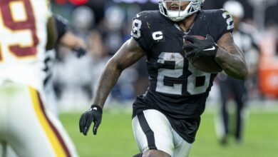 Archival full-frame photograph of Josh Jacobs playing for the Las Vegas Raiders in December 2021