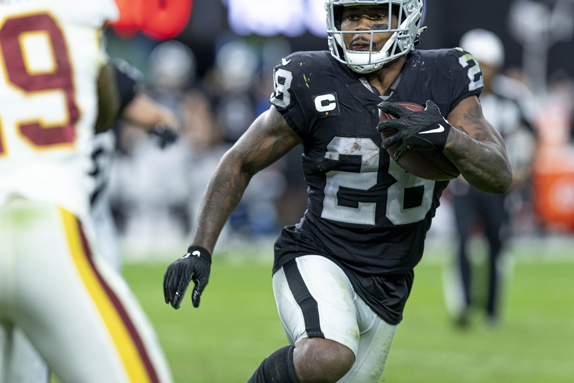 Archival full-frame photograph of Josh Jacobs playing for the Las Vegas Raiders in December 2021