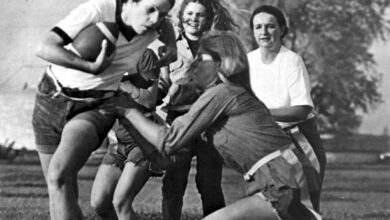 Archival full-frame 1972 photograph of a women’s recreational flag football game