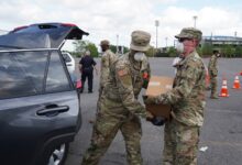 Archival photograph of Louisiana National Guard members distributing food for Second Harvest Food Bank in Metairie in April 2020